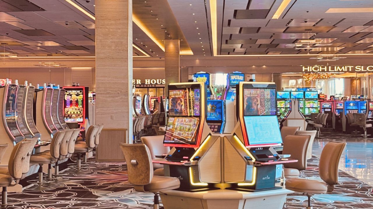 Casino floor featuring slot machines and chairs